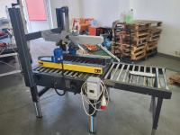 Машина для запечатывания картонных коробок производитель Siat S. P. A с роликовым конвейером