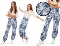 Разноцветные спортивные штаны в горошек