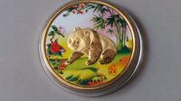 Коллекционная монета панда
